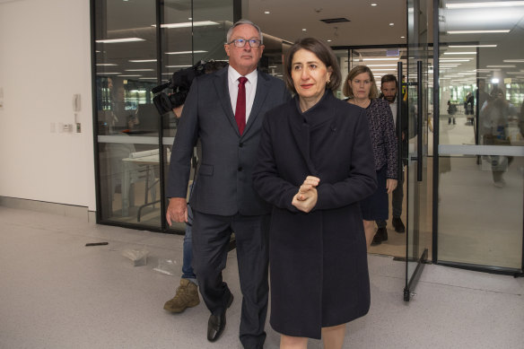 NSW Health Minister Brad Hazzard, NSW Premier Gladys Berejiklian and NSW Chief Health Officer Kerry Chant tour the mass vaccination hub at Sydney Olympic Park in April.