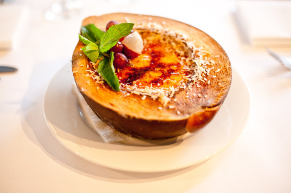 The crema catalana is akin to crème brulee served in half a coconut shell.