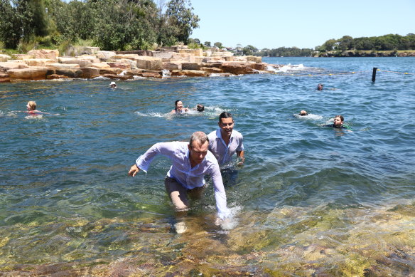 NSW Cities Minister Rob Stokes and member for Sydney Alex Greenwich take a plunge at Marrinawi Cove.