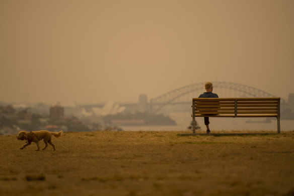 Smoke casts an orange pall across Sydney last December.