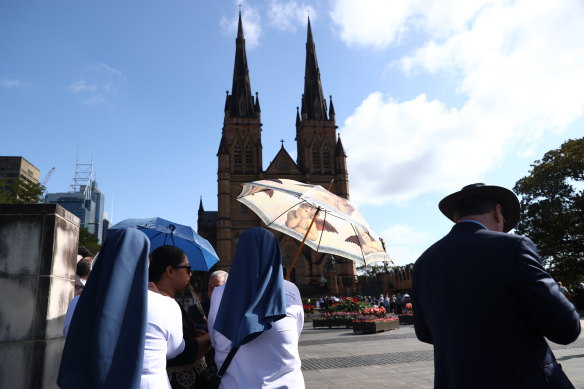 People lining up to attend the mass for the late cardinal George Pell at St Mary’s Cathedral in Sydney. 