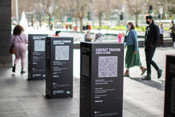 Melburnians check in to the NGV via the QR code system.