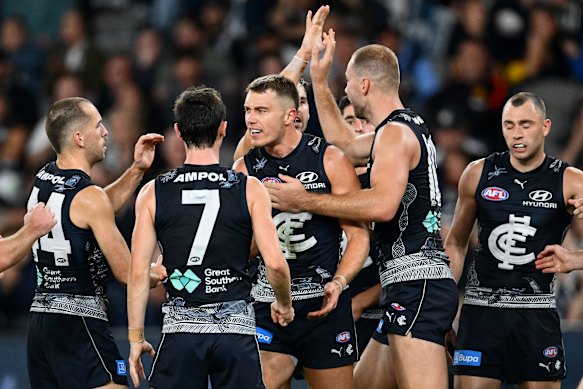 The Blues get around their inspirational leader, Patrick Cripps.