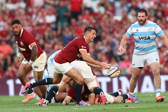 Alex Mitchell of British & Irish Lions passes the ball 