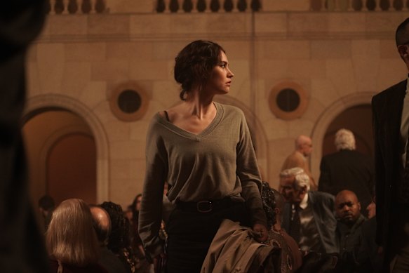 Lily James plays a biotech scientist in possession of evidence of serious unethical conduct.