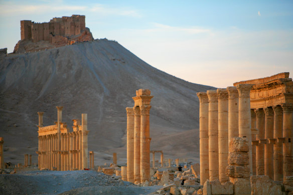 People visit the impressive Roman remains of Palmyra before the war. The city's treasured ruins were destroyed by Islamic State.
