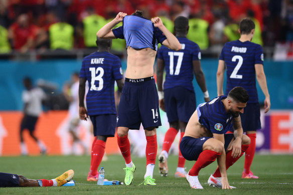 France players react after Kylian Mbappe’s decisive penalty miss.