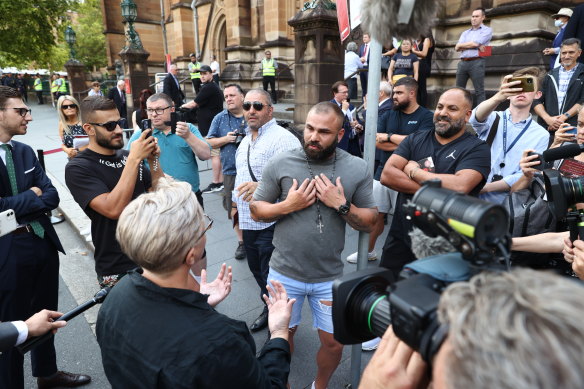 A heated exchange earlier this morning outside St Mary’s Cathedral in Sydney. 
