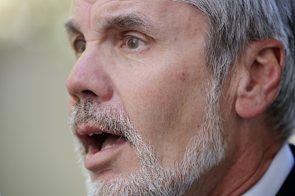 Professor Will Steffen addressing the media during a doorstop interview at Parliament House in Canberra in 2013.