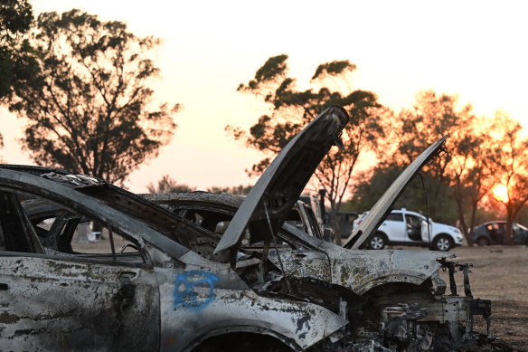 Burnt out cars the site of the Supernova Music Festival in Kibbutz Re’im when Israelis were massacred on Saturday.  Israeli soldiers continue to search for ID and belongings among the cars and tents.