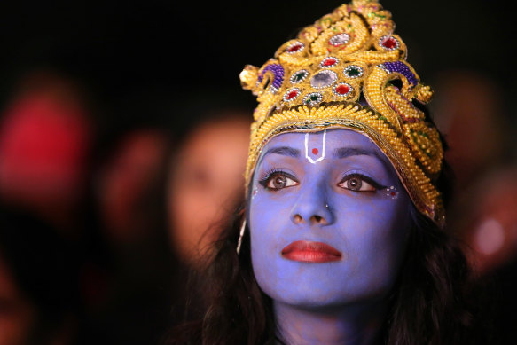 A dancer playing Lord Krishna waits to go on stage during Diwali in Leicester in Britain.