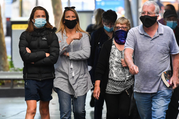 A common sight: People wear masks on the street in Melbourne.