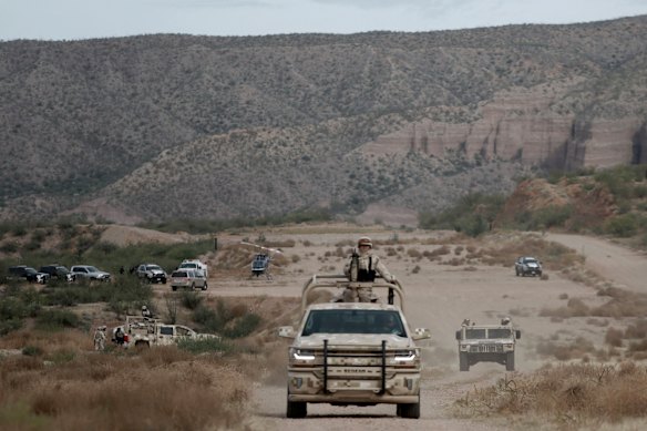 Mexican military patrol in La Mora, where the Mormon community are holding the funeral for those killed by drug cartel gunmen.