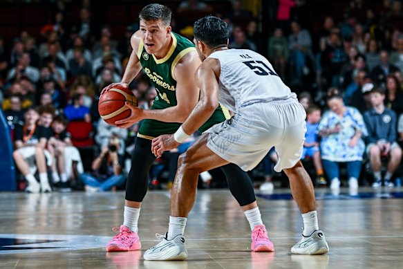 Dejan Vasiljevic of the Boomers looks to pass defended by Shea Ili of the Tall Blacks during the Trans-Tasman Throwdown opening match.