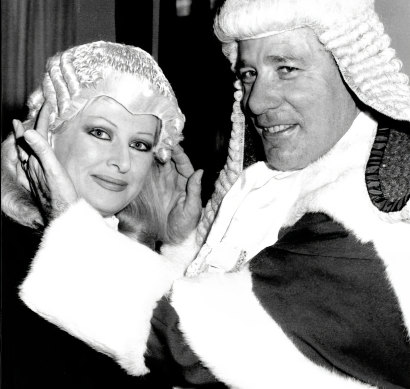 Partners-in-law: Judge Rogers adjusting the wig of his wife Helen Coonan when she was admitted to the Bar in July, 1986.