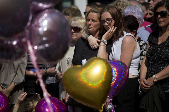 People hold a minute of silence in a square in central Manchester, England, on May 25, 2017, after the suicide bombing attack.