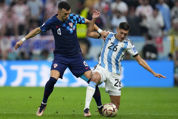 Croatia’s Ivan Perisic, left, and Argentina’s Nahuel Molina vie for the ball during the World Cup semifinal.