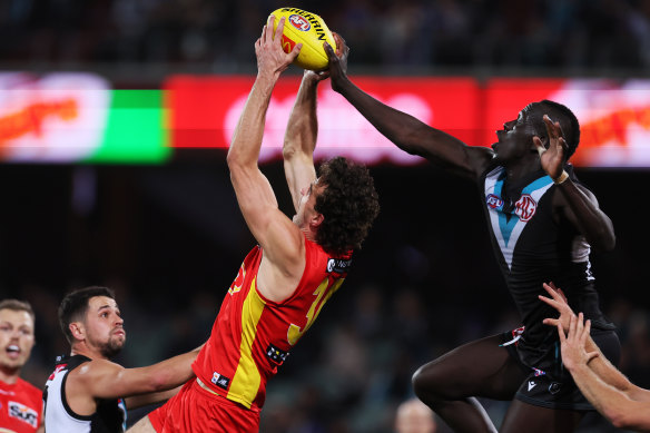 Gold Coast’s Ben King is spoiled by Port’s Aliir Aliir.