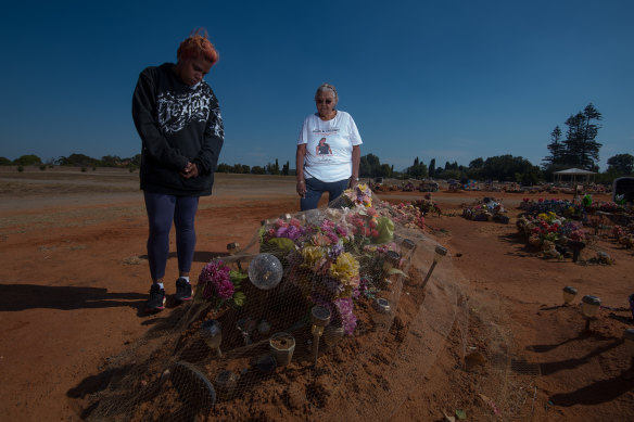 Sherona Roe and Carol Roe at the grave of  Ms Dhu in the Geraldton cemetery. 