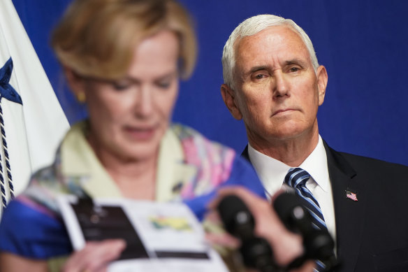 US Vice-President Mike Pence listens to Dr Deborah Birx at the coronavirus taskforce briefing.