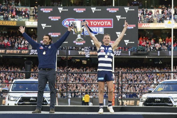 Joel Selwood and Chris Scott celebrate the Cats’ premiership success.