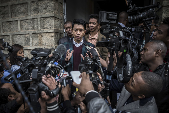 President Andry Rajoelina of Madagascar speaks to reporters after voting during legislative elections in Antananarivo, Madagascar, in late May 2019