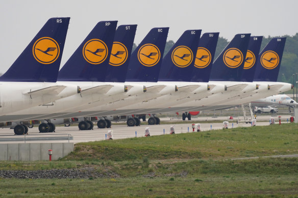Passenger planes of German airliner Lufthansa stand parked and not in use at Willy Brandt Berlin Brandenburg International Airport