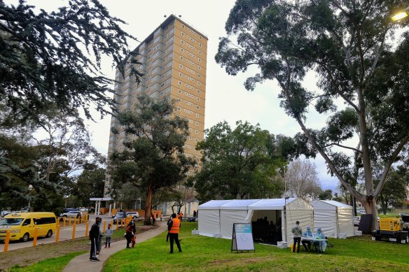 Victorian Health staff prepare a COVID testing site at the Flemington public housing tower in Melbourne in August.