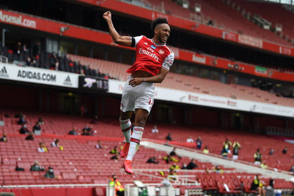 Pierre-Emerick Aubameyang of Arsenal celebrates after scoring his team's first goal during the Premier League match between Arsenal FC and Norwich City at Emirates Stadium.