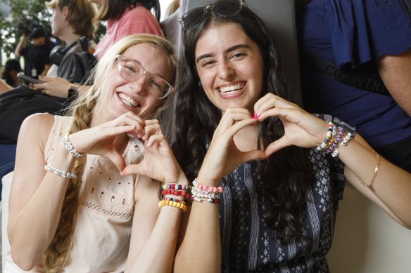 Hannah Brown and Selena Cardillo, both 21, passed the time waiting to buy Taylor Swift tickets by making bracelets of Swift’s song lyrics and titles.