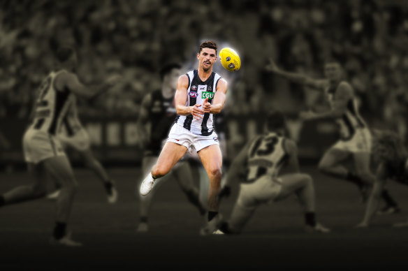 Scott Pendlebury disposes of the ball in a game against Essendon in 2019.