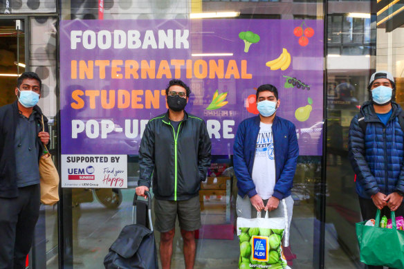 Students Arum Kumar, Akar Gupta, Nitin Kumar and Shravan Kumar at the Aurora Melbourne Central Foodbank International Student Pop-Up Store. 