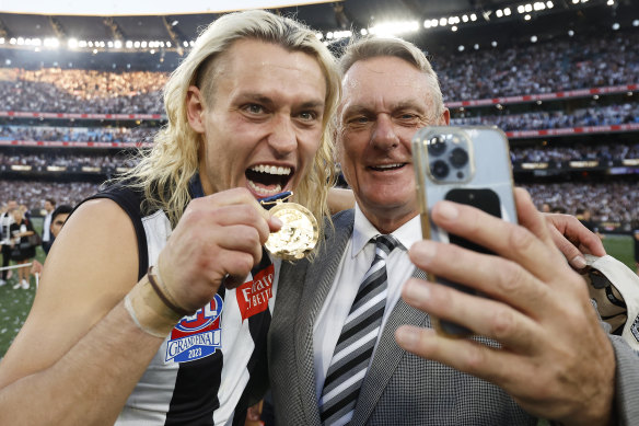 A grand final with Moore: Collingwood skipper Darcy Moore with his famous father.