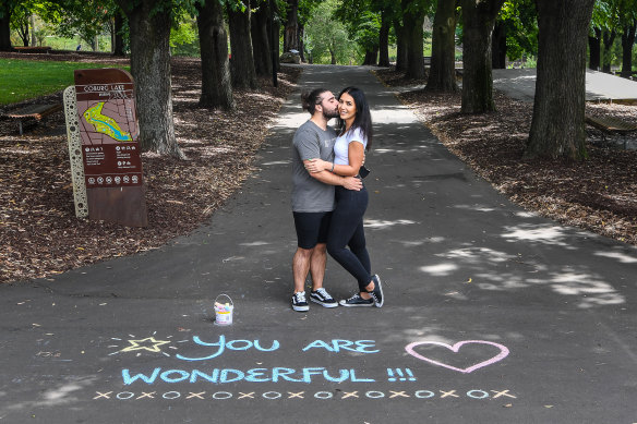 Bruno Arena and Tash Pareskevi at Coburg Lake Reserve where their romance - and chalk art - began.