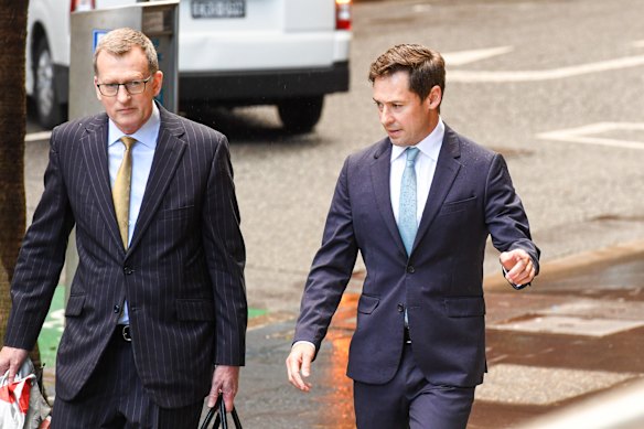 Nick McKenzie (right) outside the Federal Court in Sydney on Thursday.
