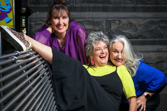 Jacqui Richards (left), and Trish Hurley (right) and Chris Ryan – the Canberra mum and comedian who convinced them both to start their successful comedy careers three years ago.