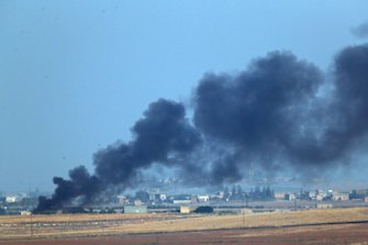 Smoke billows from a fire inside Syria during bombardment by Turkish forces.