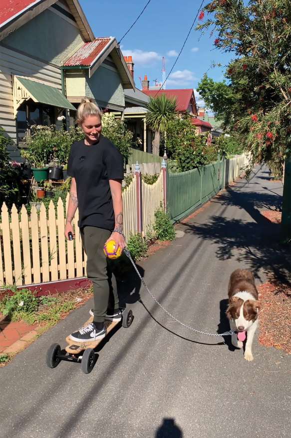 Harris walking her dog, Beans, around her neighbourhood. 