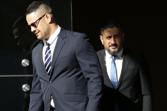 Jarryd Hayne and his lawyer Leo Premutico leave Newcastle Local Court.