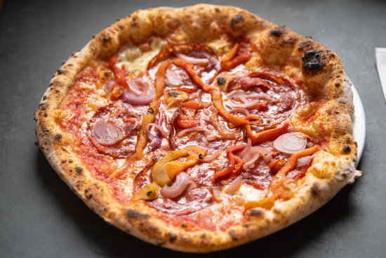 Pizza Diavola with spicy salami, onion and roasted capsicum.