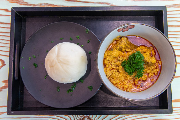 Egusi (soup) with fufu (pounded yam).