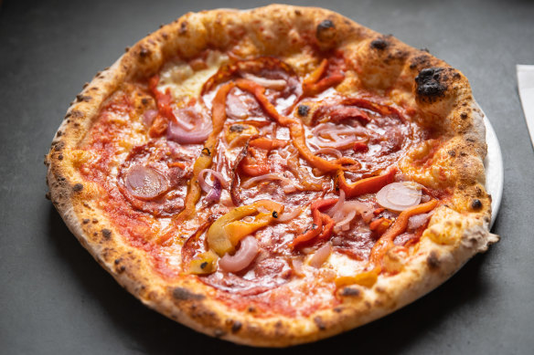 Pizza Diavola with spicy salami, onion and roasted capsicum.