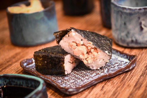 Onigiri Kitchen’s salmon and nori-wrapped onigiri sounds similar to a sushi roll, but are quite different.