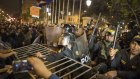Police fight over security gates with supporters of President Martin Vizcarra outside Congress as the president's supporters try to enter the building.
