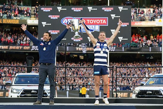 Joel Selwood and Chris Scott celebrate the Cts’ premiership win.