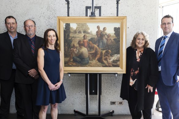 Marc Nickl, Trevor Nickl, Nerissa Nickl, Jo Frater and Tracy Nickl, with, Bush walkers 1944 by Freda Robertshaw, donated by the Nickl family, at the National Gallery of Australia in Canberra on Wednesday.