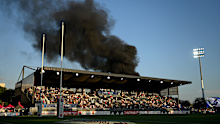 Smoke outside the stadium caused a delay before the game. 