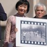 Pulitzer Prize-winning photographer Nick Ut (centre)  and Kim Phuc (left) holds the “Napalm Girl” photo in 2022.