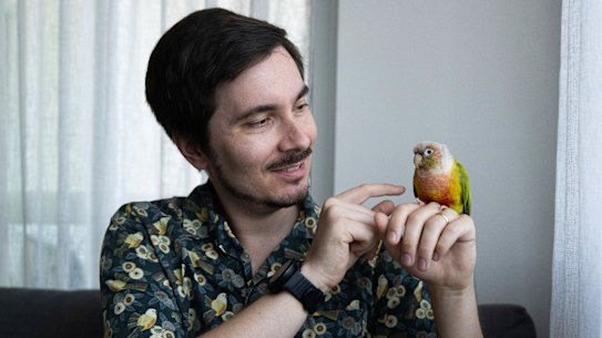 Schuster and Connie, a green-cheeked parrot he rescued from his first job as a vet.