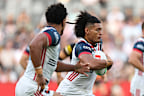 Naufahu Whyte of the Roosters runs the ball.